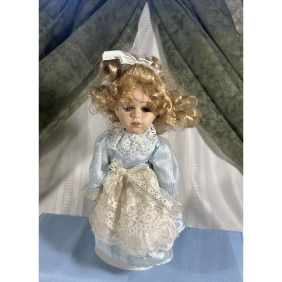 beautiful porcelain doll 12” Blue satin dress with layers of lace Curly hair - Picture 1 of 9